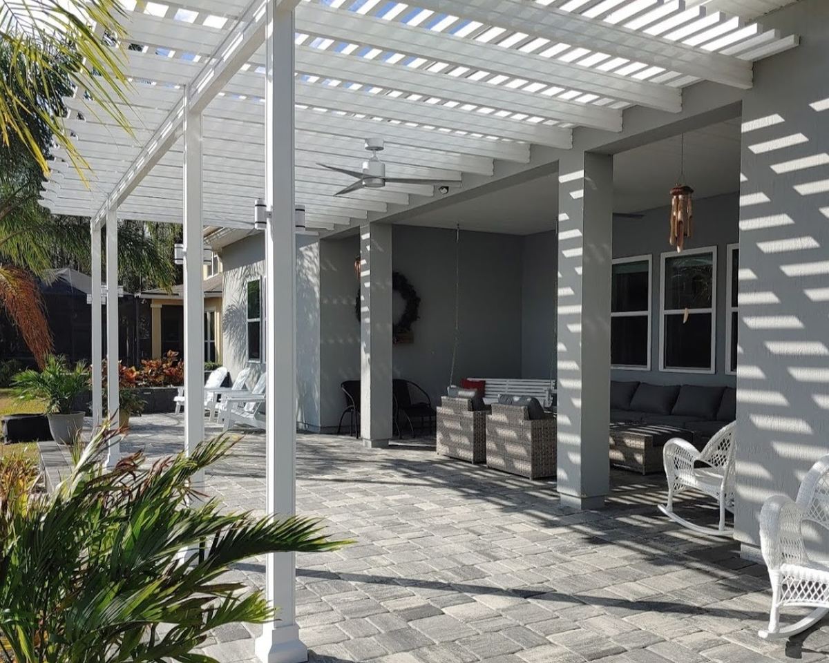 Attached pergola with a slatted top and square posts, built by Better Home Improvement in Jacksonville, FL