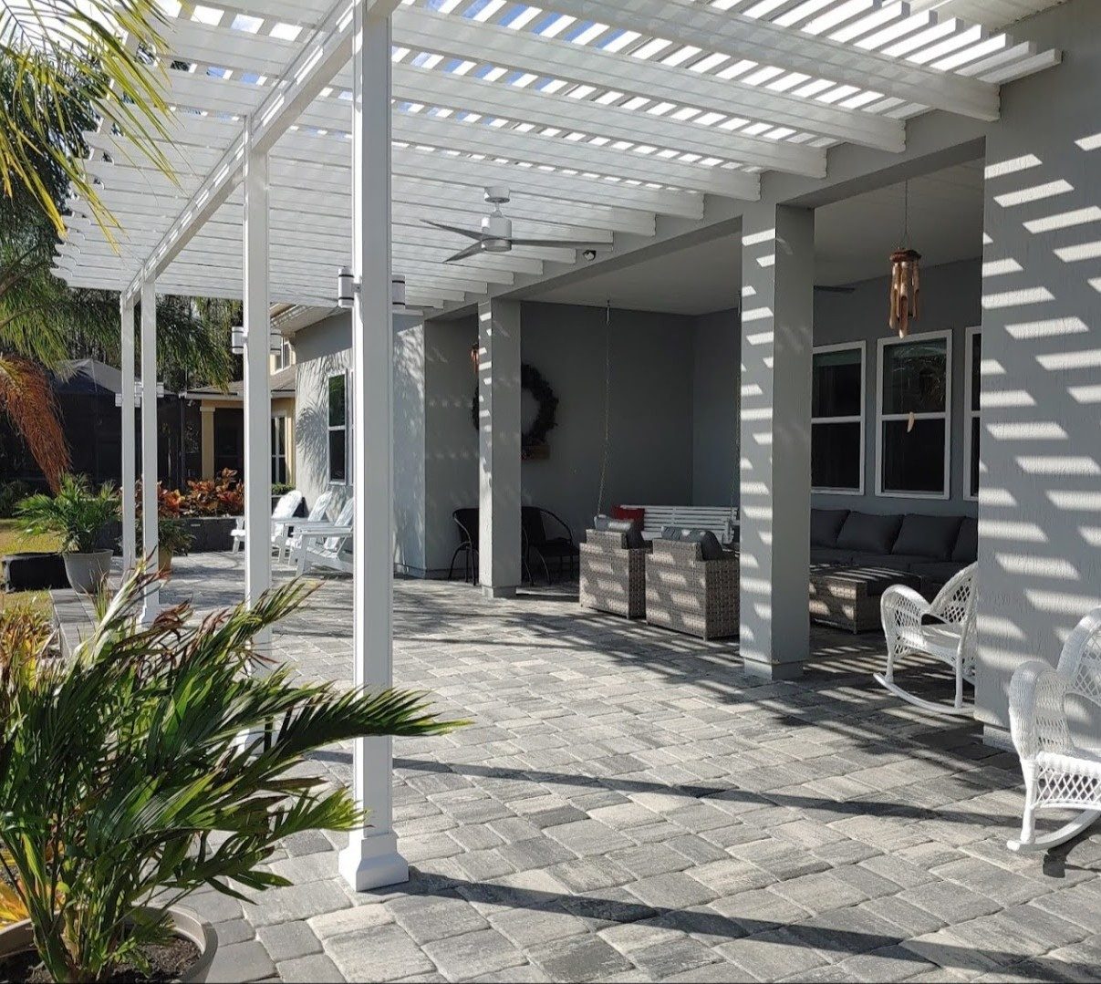 Attached pergola with a slatted top and square posts, built by Better Home Improvement in Jacksonville, FL