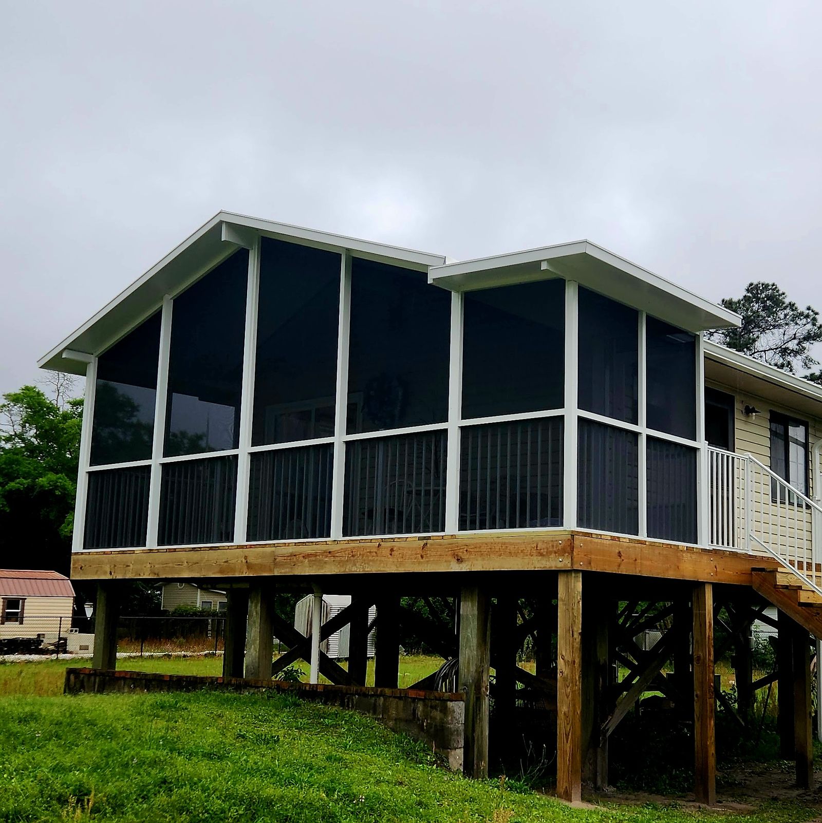 Gable screen room built by Better Home Improvement on a raised deck in Jacksonville, FL