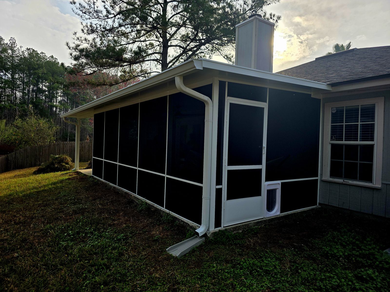 Screen room with a solid roof, built by Better Home Improvement in Orange Park, FL