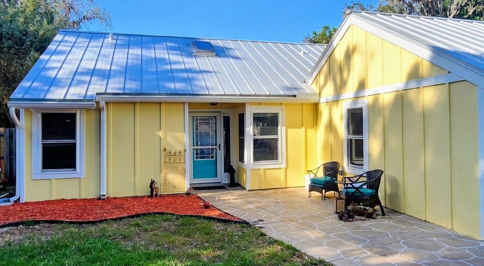 Single-story home with Hardie board-and-batten siding installed by Better Home Improvement in St. Augustine, FL