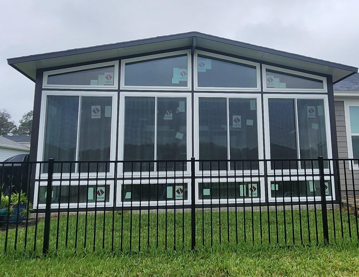 Gable glass sunroom with dark trim